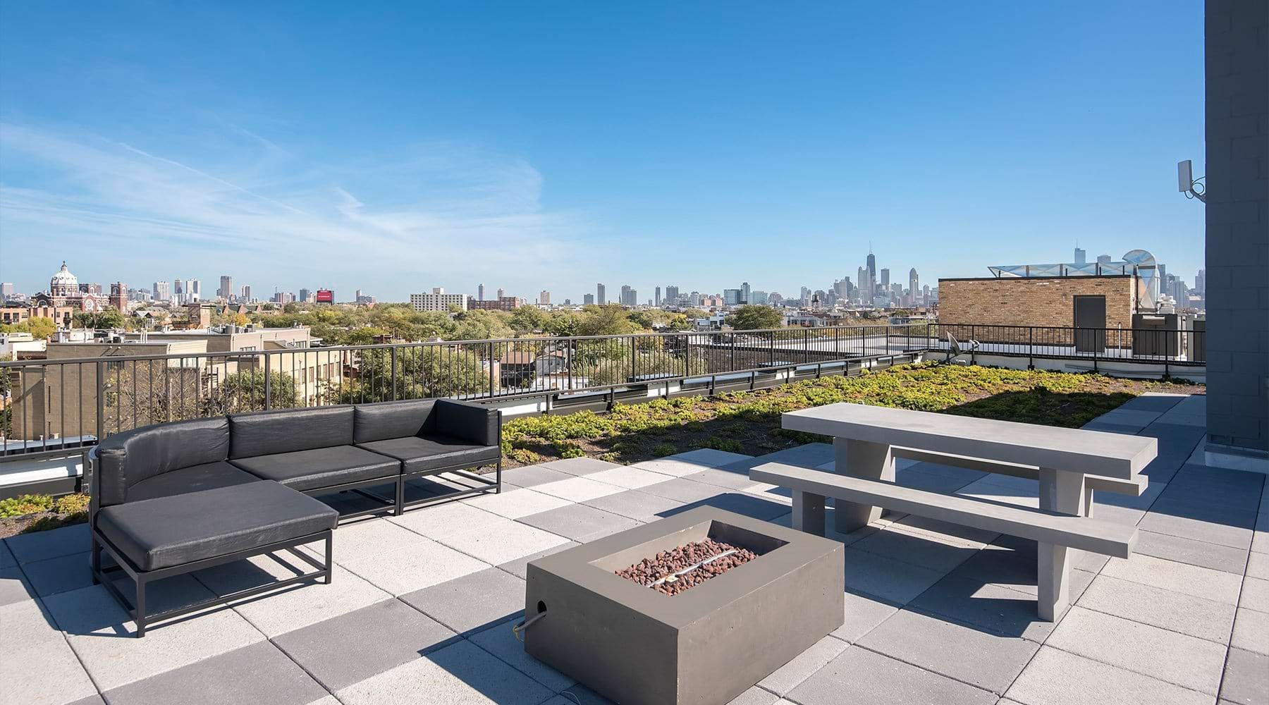 a rooftop deck with seating