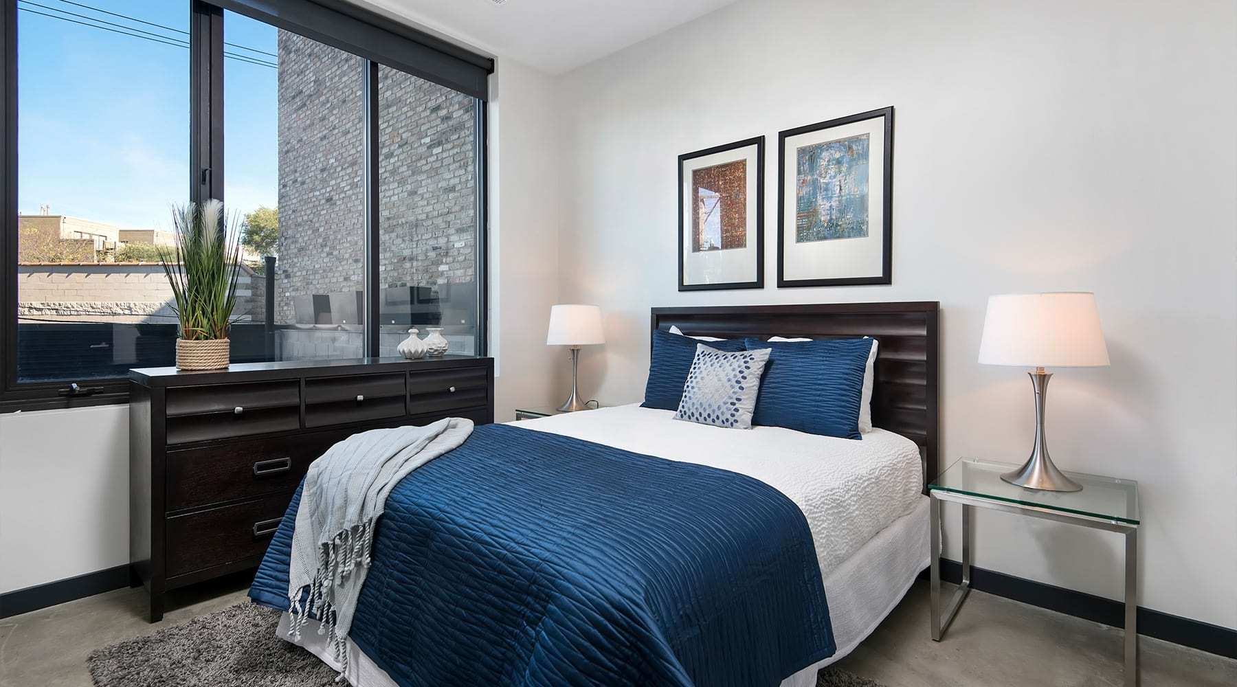 a bedroom with a large window