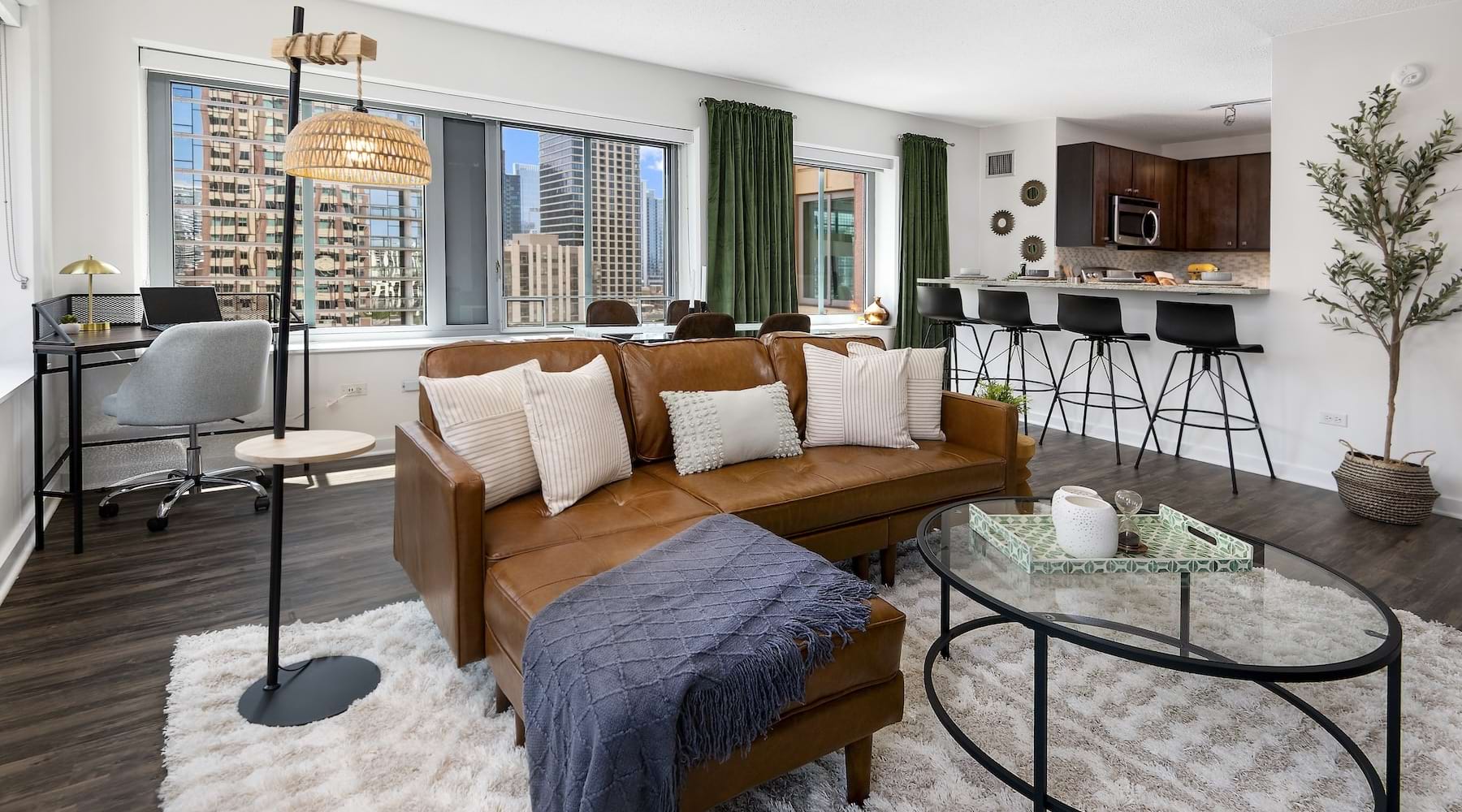 Furnished Chestnut Tower apartment living room with floor-to-ceiling city views