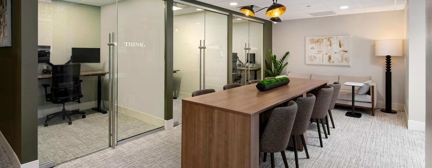 Chestnut Tower coworking space with private offices and a communal conference table