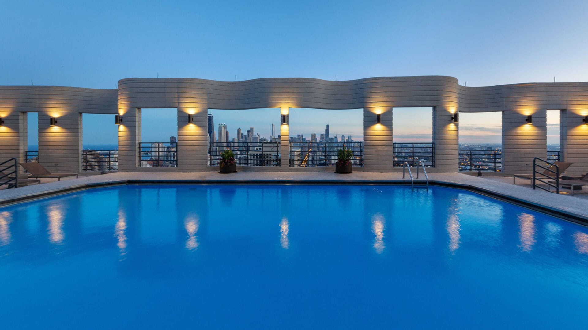 Rooftop Pool Deck Overlooking City Skyline