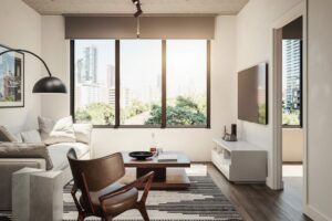 Bright living room with city skyline view, contemporary furniture, and natural light.