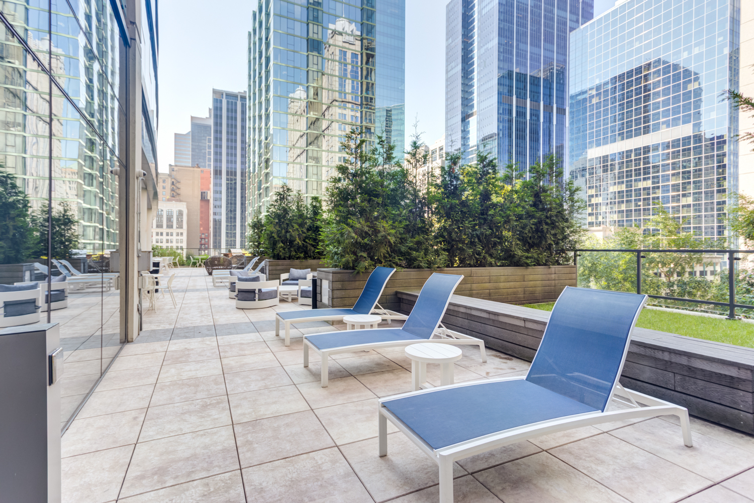 Terrace with lounge chairs at Lake & Wells Chicago apartments