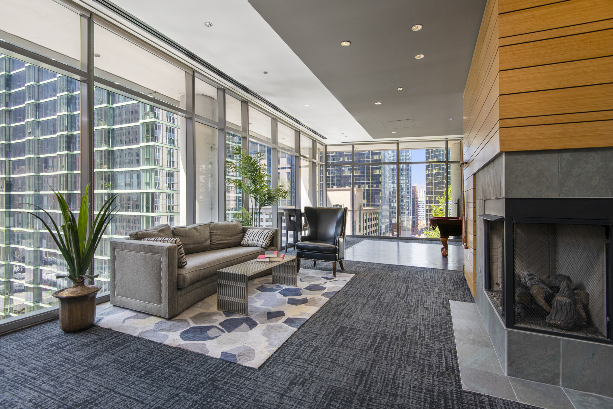 Common area at Lake & Wells with couch and fireplace at our apartments for rent in Chicago.